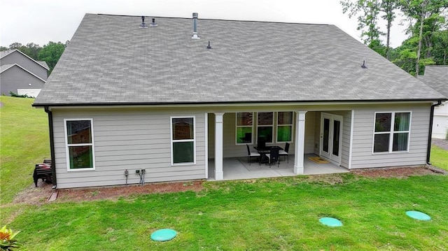 2129 Charmond Dr, Monroe, GA 30656 - back of house featuring a patio, a yard, and a shingled roof