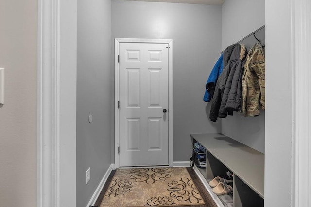 mudroom with light tile patterned floors and baseboards