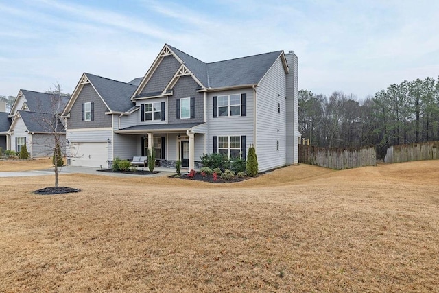 view of front of house featuring a garage, covered porch, fence, a front lawn, and a chimney