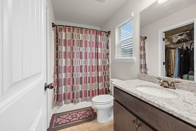 full bathroom with toilet, shower / tub combo, vanity, and tile patterned floors