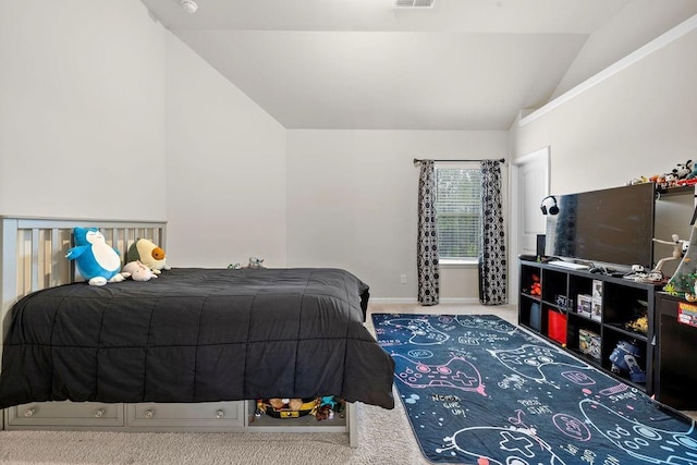 carpeted bedroom featuring lofted ceiling, visible vents, and baseboards