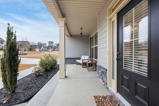 view of patio with a porch and a residential view