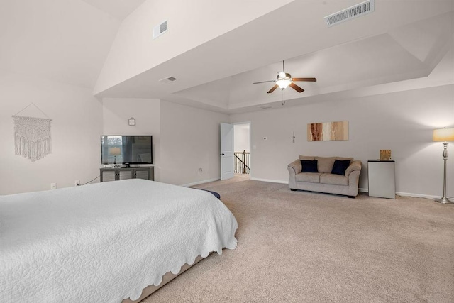 bedroom with carpet, visible vents, a raised ceiling, and baseboards