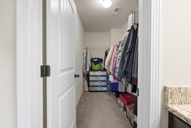 spacious closet with carpet floors and visible vents