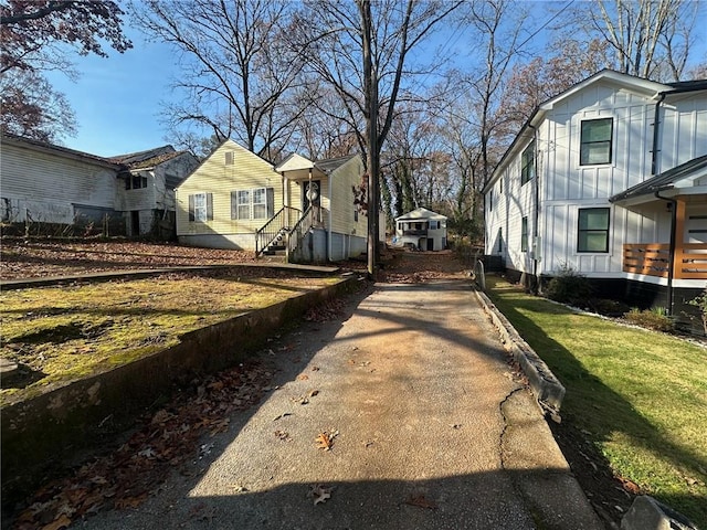 view of side of property featuring a yard