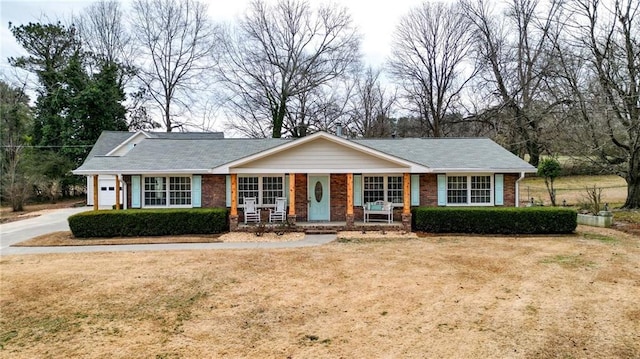 ranch-style house with a front lawn