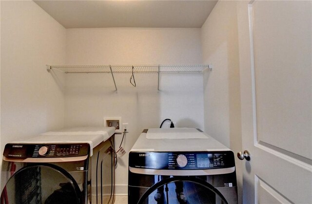 washroom with washer and clothes dryer