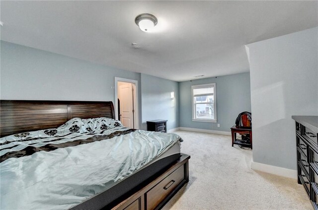 bedroom with light colored carpet