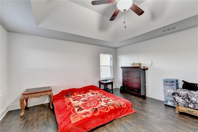 bedroom featuring ceiling fan and dark wood-type flooring