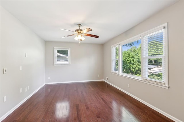 1231 Sanden Ferry Dr, Decatur, GA 30033 - spare room featuring dark wood-style flooring, a ceiling fan, and baseboards