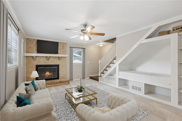 1231 Sanden Ferry Dr, Decatur, GA 30033 - living room with a fireplace, carpet flooring, visible vents, stairs, and ornamental molding
