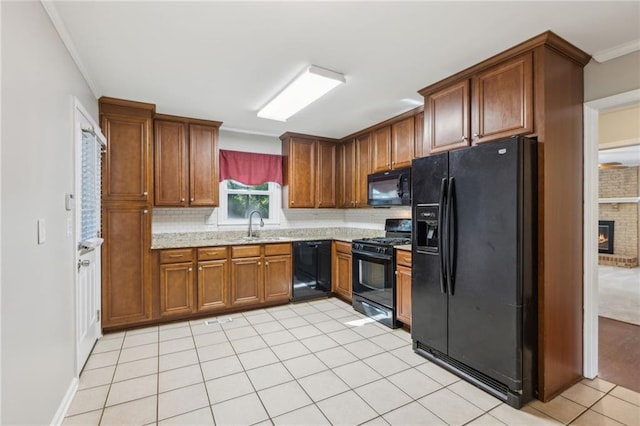 1231 Sanden Ferry Dr, Decatur, GA 30033 - kitchen featuring brown cabinets, light tile patterned floors, tasteful backsplash, a sink, and black appliances
