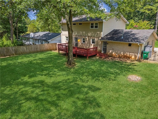1231 Sanden Ferry Dr, Decatur, GA 30033 - back of property with a fenced backyard, a yard, a deck, and brick siding