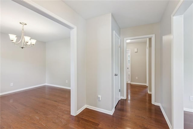 1231 Sanden Ferry Dr, Decatur, GA 30033 - hallway with a notable chandelier, baseboards, and wood finished floors