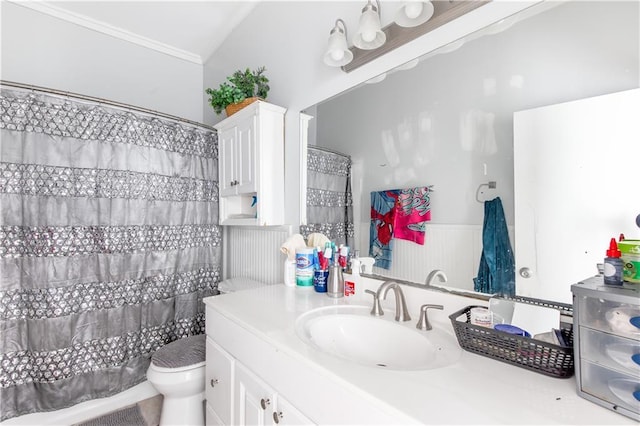 bathroom featuring toilet, crown molding, vanity, and curtained shower