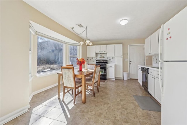 1056 Shadow Lake Dr, Lithonia, GA 30058 - dining area with baseboards and a chandelier