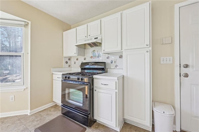 1056 Shadow Lake Dr, Lithonia, GA 30058 - kitchen featuring black range with gas cooktop, under cabinet range hood, white cabinets, light countertops, and tasteful backsplash