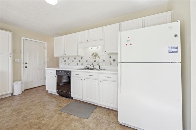 1056 Shadow Lake Dr, Lithonia, GA 30058 - kitchen with freestanding refrigerator, black dishwasher, white cabinets, and light countertops