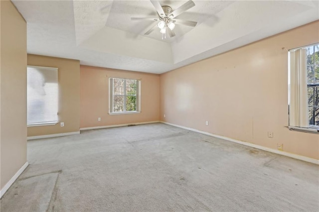 1056 Shadow Lake Dr, Lithonia, GA 30058 - empty room with a raised ceiling, carpet floors, and ceiling fan