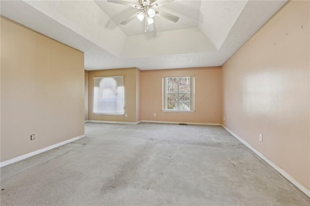 1056 Shadow Lake Dr, Lithonia, GA 30058 - empty room with a raised ceiling, a ceiling fan, and carpet flooring