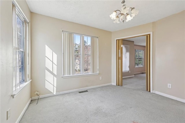 1056 Shadow Lake Dr, Lithonia, GA 30058 - carpeted spare room with a chandelier and baseboards