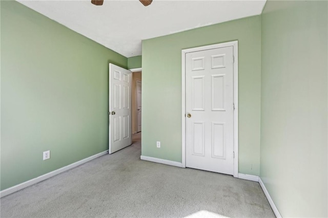 1056 Shadow Lake Dr, Lithonia, GA 30058 - unfurnished bedroom featuring carpet flooring and ceiling fan
