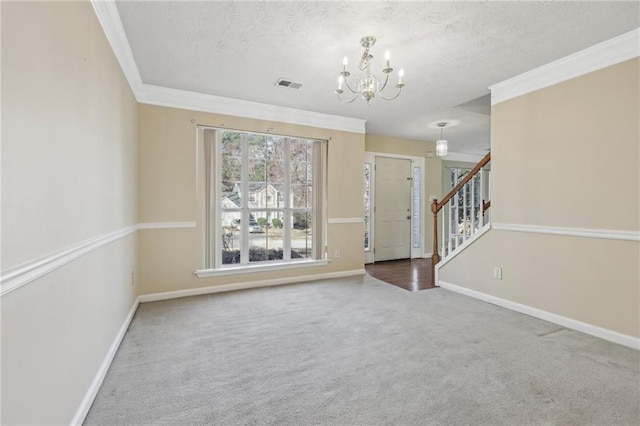 1056 Shadow Lake Dr, Lithonia, GA 30058 - entryway featuring a chandelier, carpet flooring, ornamental molding, stairs, and a textured ceiling