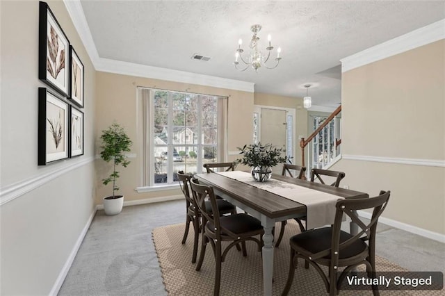1056 Shadow Lake Dr, Lithonia, GA 30058 - dining space with light colored carpet, a chandelier, stairway, a textured ceiling, and crown molding