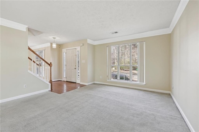 1056 Shadow Lake Dr, Lithonia, GA 30058 - carpeted foyer entrance with stairway, crown molding, and a textured ceiling