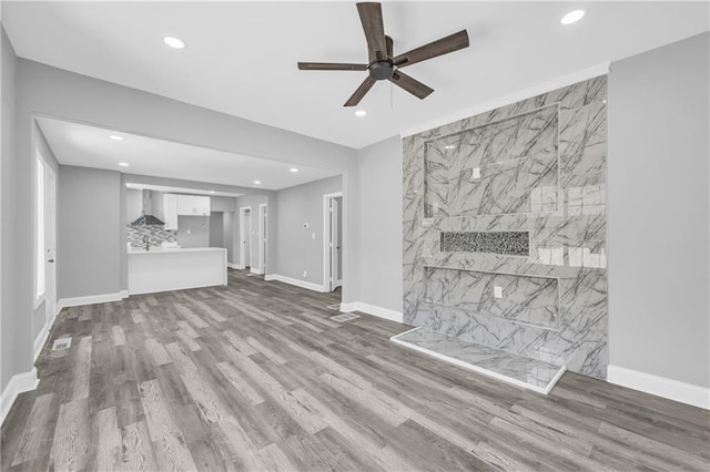85 Ollie St, Atlanta, GA 30314 - unfurnished living room with a ceiling fan, recessed lighting, and wood finished floors