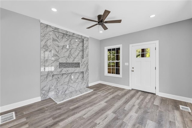 85 Ollie St, Atlanta, GA 30314 - unfurnished living room with ceiling fan, recessed lighting, and wood finished floors