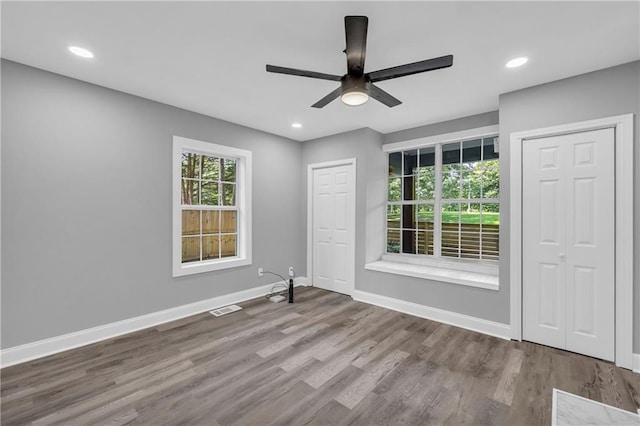 85 Ollie St, Atlanta, GA 30314 - spare room featuring wood finished floors, ceiling fan, and recessed lighting