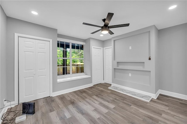 85 Ollie St, Atlanta, GA 30314 - unfurnished living room with a ceiling fan, wood finished floors, and recessed lighting