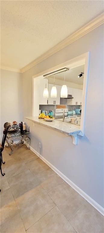 interior space featuring crown molding and tile floors