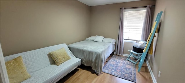 bedroom featuring light wood-type flooring