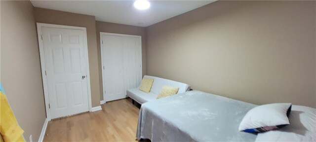 bedroom with light hardwood / wood-style flooring