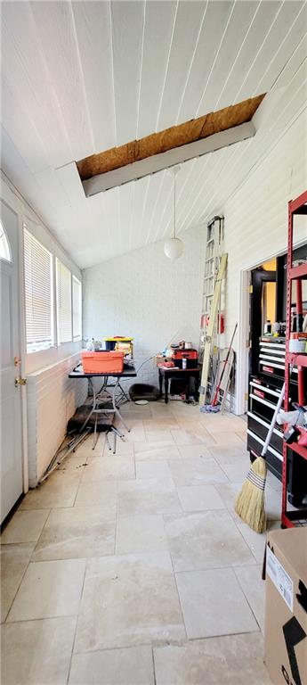 miscellaneous room featuring beam ceiling