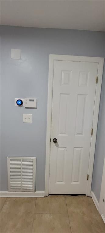 interior space featuring light tile floors