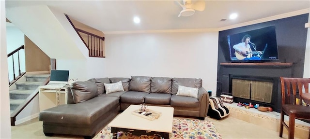 living room with ceiling fan and crown molding