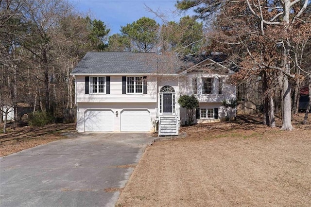 split foyer home with a garage and driveway