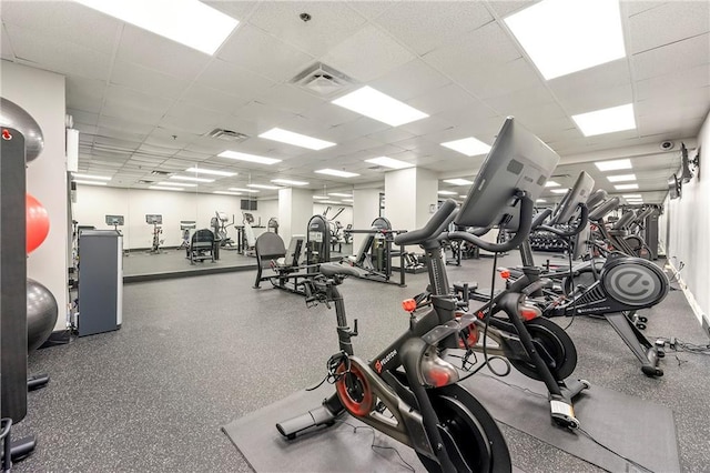 gym featuring a paneled ceiling