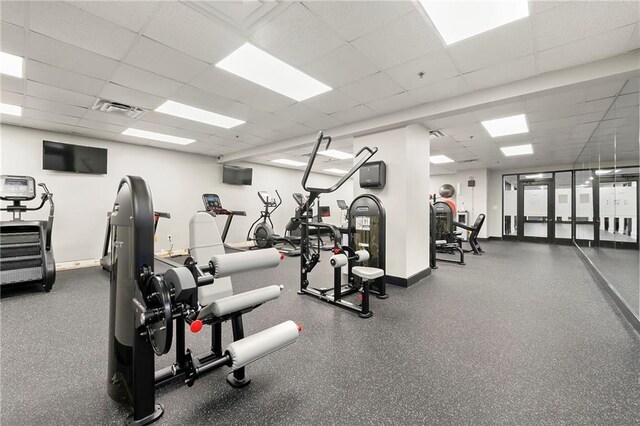 workout area featuring a drop ceiling