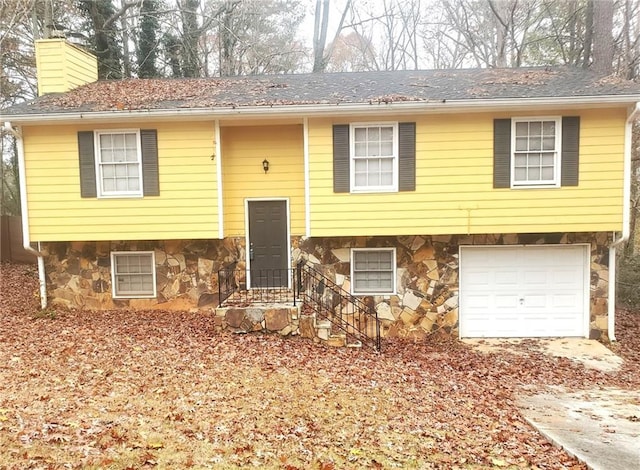 bi-level home featuring a garage