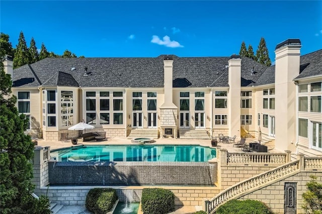 9620 Cedar Grove Rd, Chattahoochee Hills, GA 30213 - swimming pool with entry steps, french doors, a patio area, and an in-ground hot tub