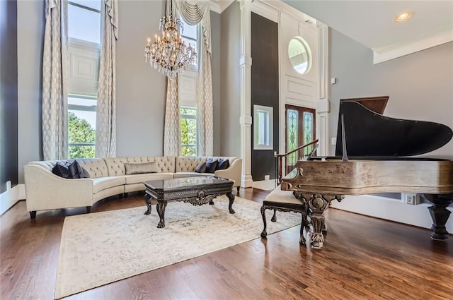 9620 Cedar Grove Rd, Chattahoochee Hills, GA 30213 - living room featuring a chandelier, wood finished floors, crown molding, a high ceiling, and recessed lighting