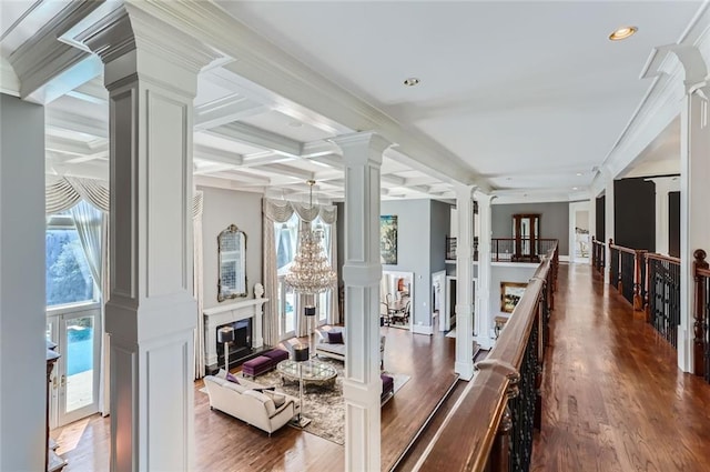 9620 Cedar Grove Rd, Chattahoochee Hills, GA 30213 - hallway with decorative columns, healthy amount of natural light, beamed ceiling, a chandelier, and wood finished floors