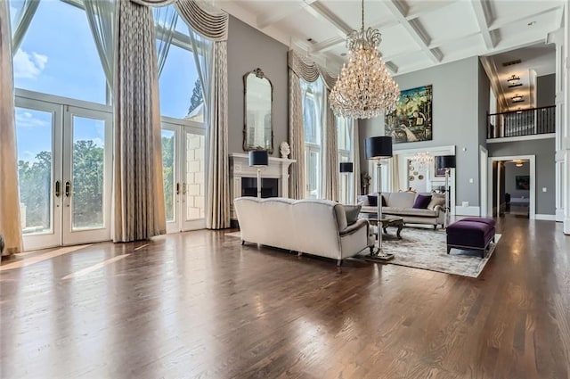 9620 Cedar Grove Rd, Chattahoochee Hills, GA 30213 - living room featuring a high ceiling, a chandelier, coffered ceiling, french doors, and beam ceiling