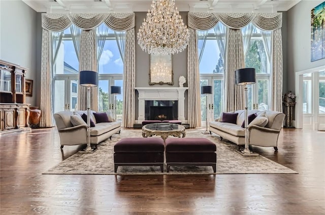 9620 Cedar Grove Rd, Chattahoochee Hills, GA 30213 - living room with a towering ceiling, coffered ceiling, wood finished floors, beamed ceiling, and a fireplace