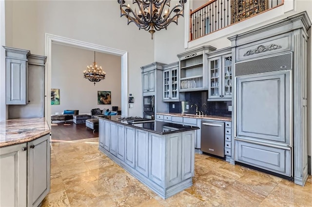 9620 Cedar Grove Rd, Chattahoochee Hills, GA 30213 - kitchen featuring a chandelier, built in appliances, a high ceiling, a center island, and gray cabinets