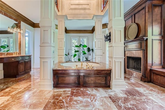 9620 Cedar Grove Rd, Chattahoochee Hills, GA 30213 - bathroom featuring marble tiled floors, decorative columns, vanity, ornamental molding, and a high end fireplace